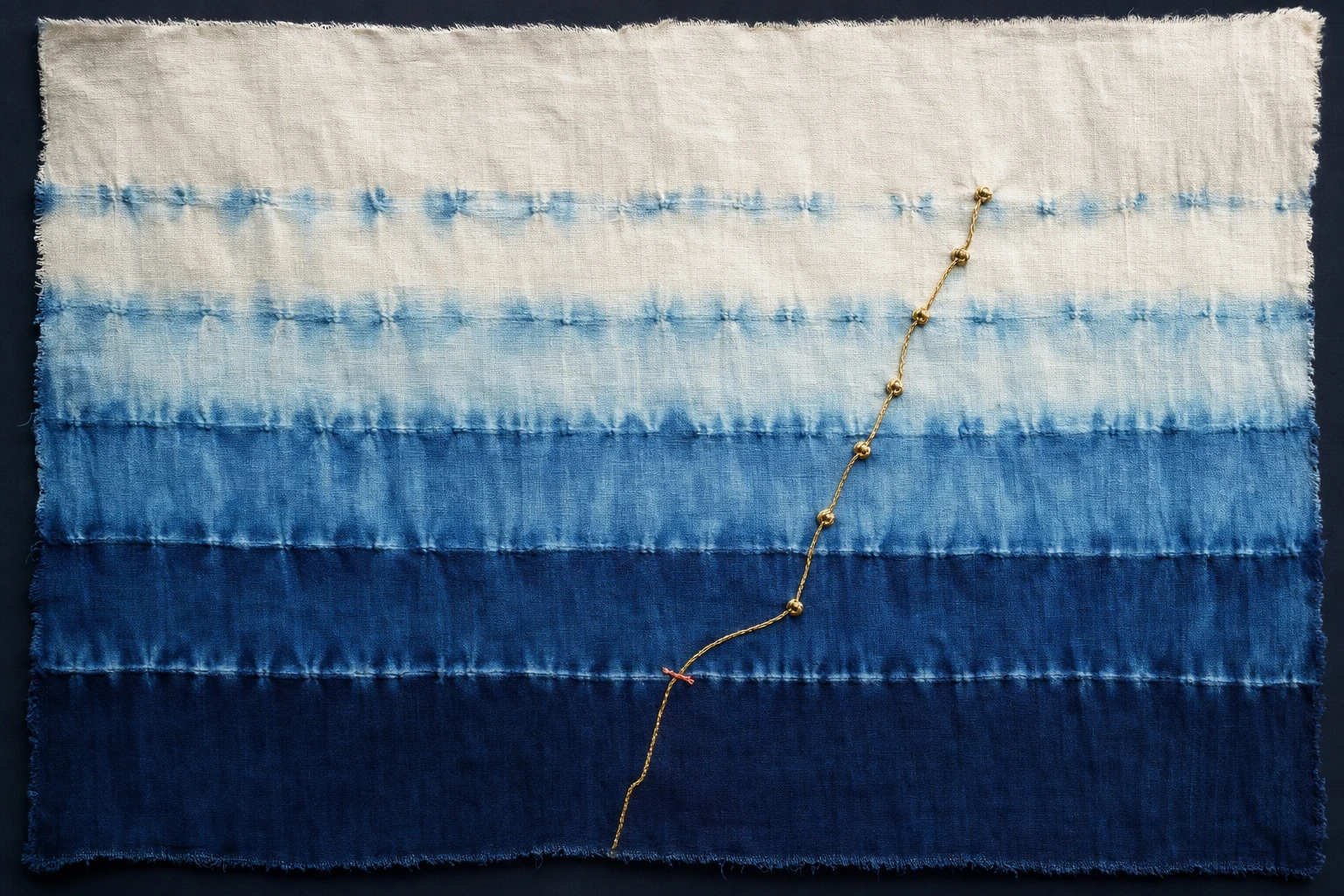 A gold thread with small knots rises through indigo bands from deep midnight to pale white, turning up before the darkest band.